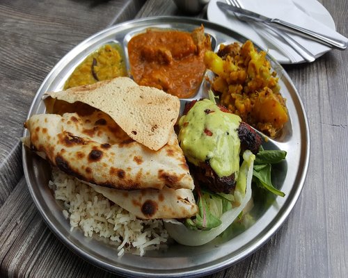 A traditional balanced Indian thali meal with roti, dal, and vegetables